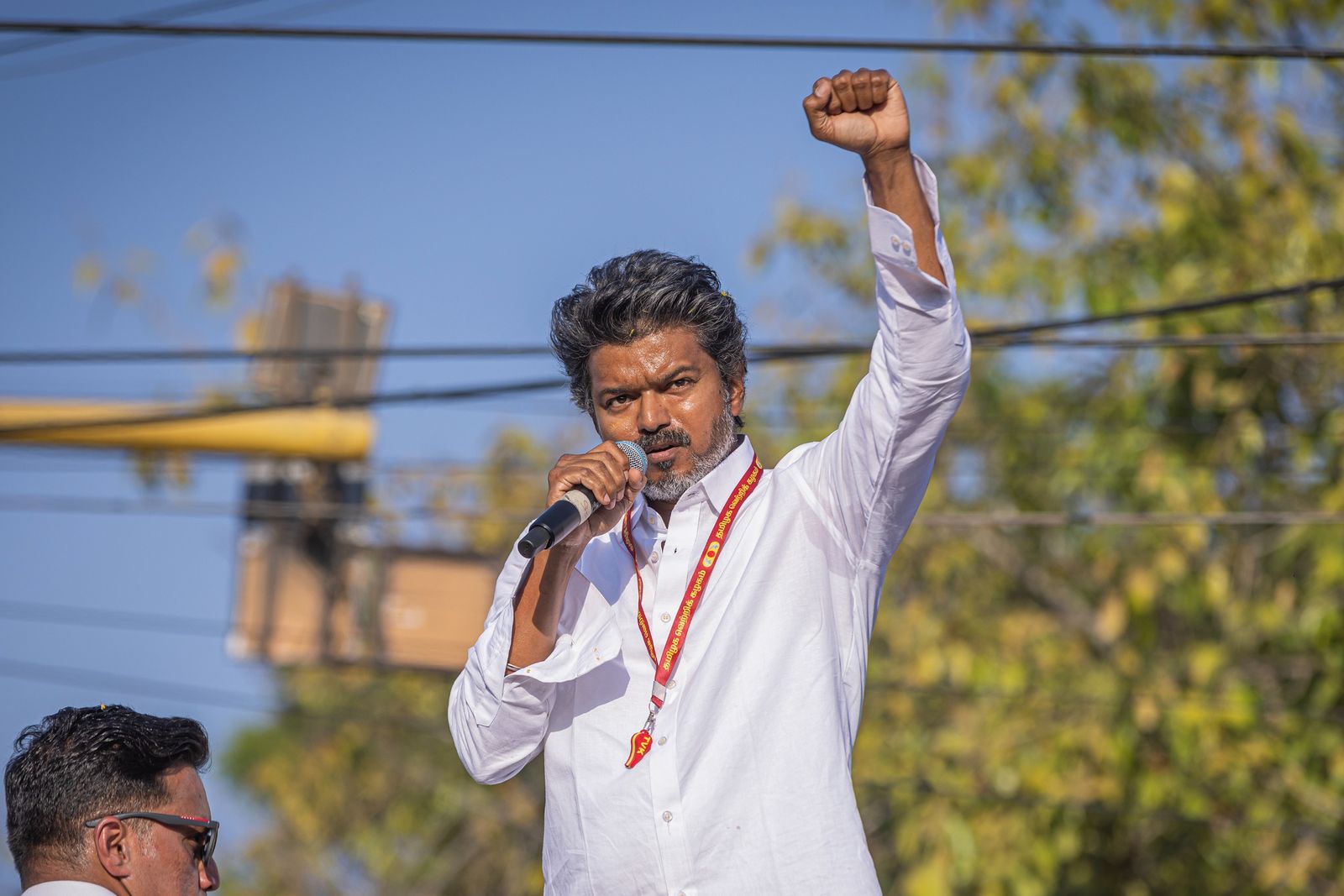 Vijay speaking to supporters during TVK's Tiruppur election campaign